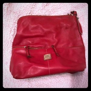 Red leather Dooney. Two front zipper pockets